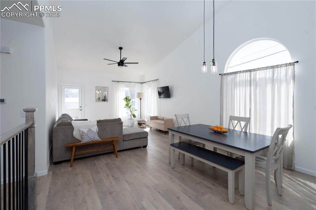 827 Circle Road Palmer Lake, CO 80133 - Photo 5 of 28 a living room with furniture and a wooden floor