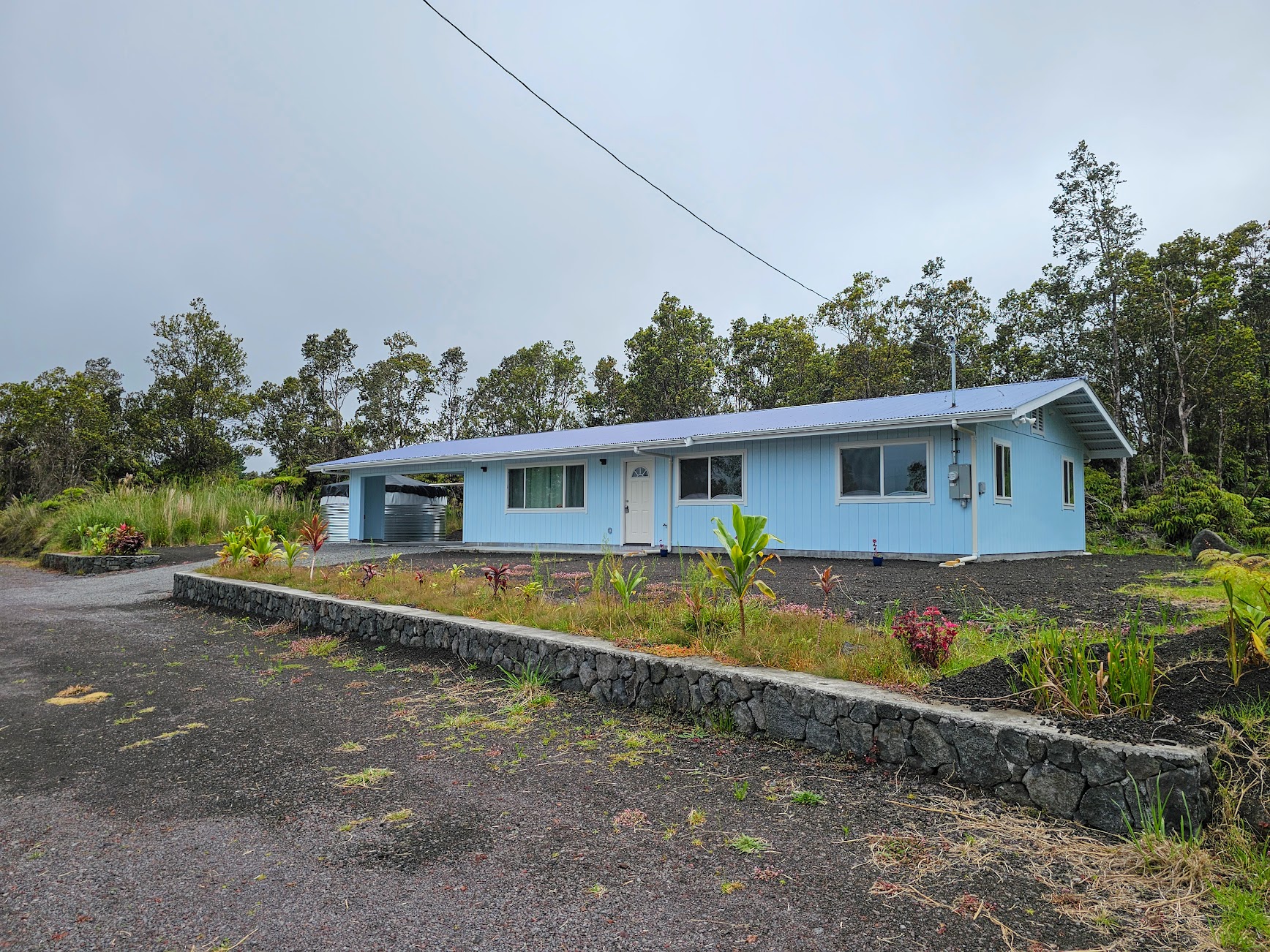 11-3387 Old Volcano Road Volcano, HI 96785 - Photo 3 of 24 front view of a house with a yard