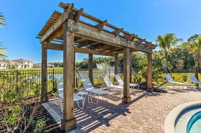 an aerial view of a houses with a swimming pool