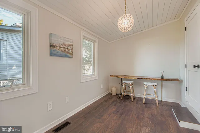 a kitchen with stainless steel appliances granite countertop a sink and wooden cabinets