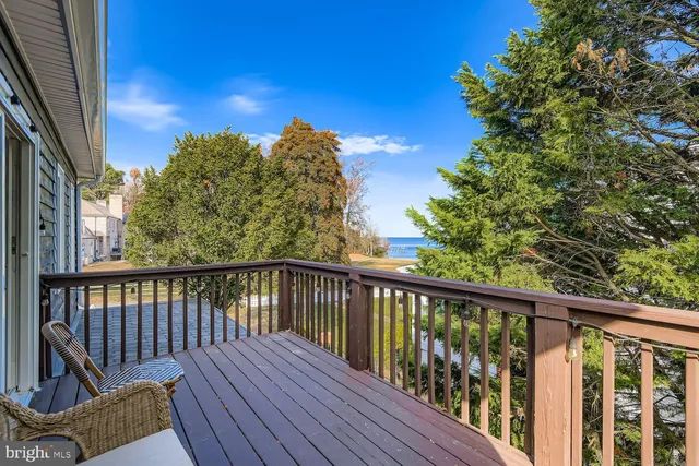a bathroom with a granite countertop toilet sink and mirror