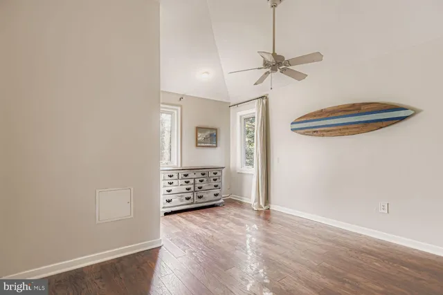 a view of a balcony with wooden floor
