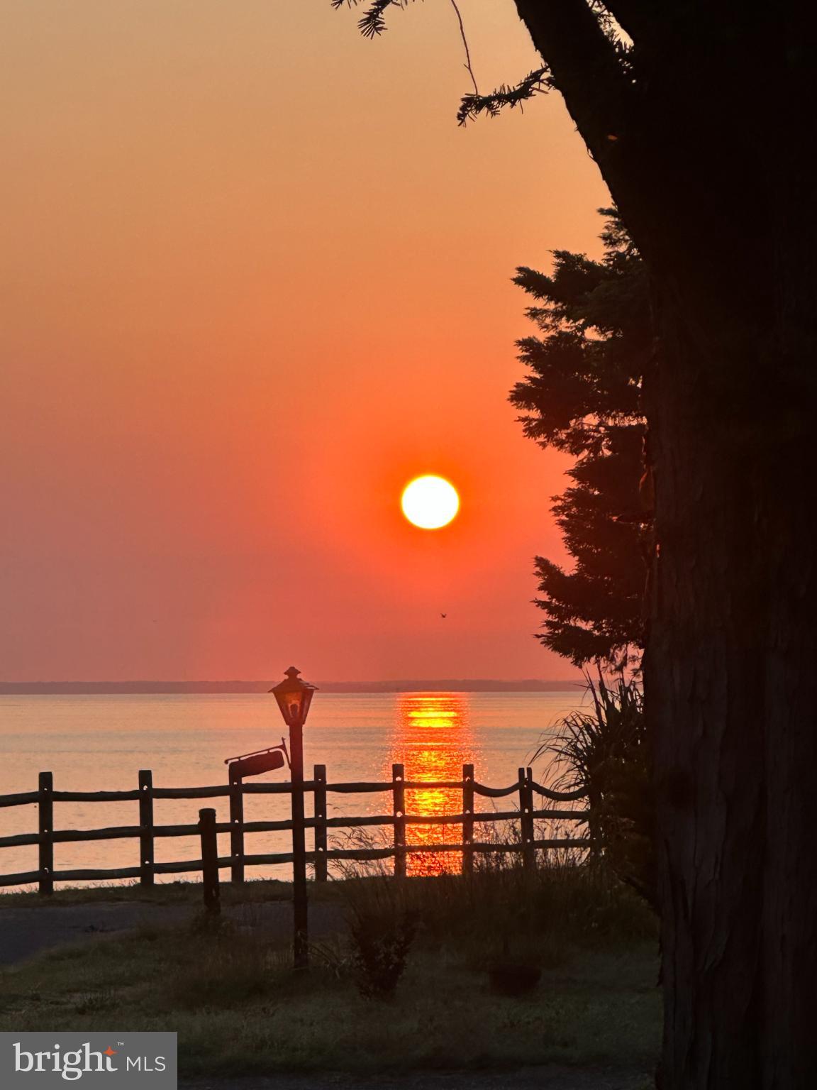 2023 Bay Road Pasadena, MD 21122 - Photo 21 of 35 Serene sunset over tranquil waters.