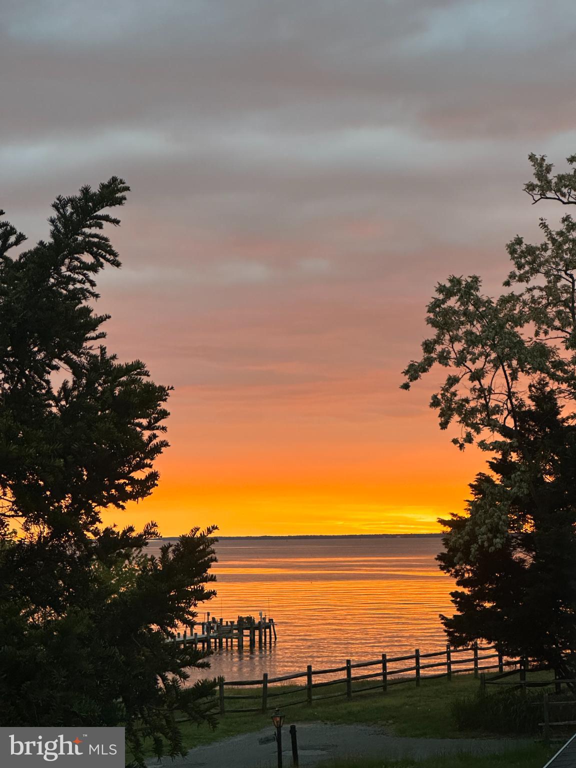 2023 Bay Road Pasadena, MD 21122 - Photo 22 of 35 Serene sunset over tranquil waters.