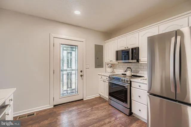 a view of a golf course with a lake view