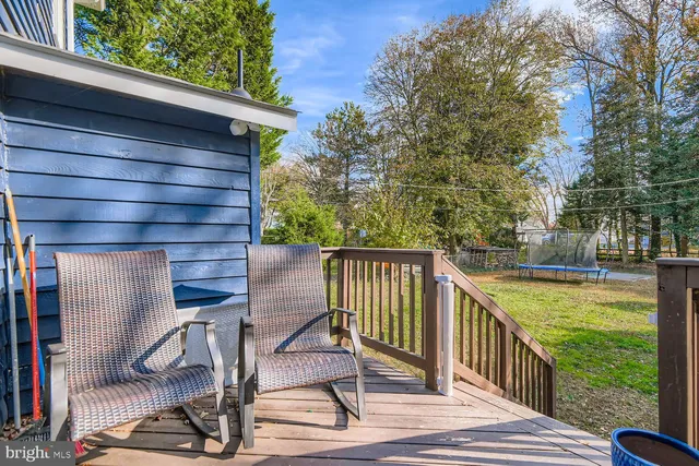 a view of a balcony with wooden floor
