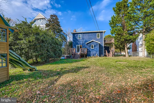 a view of outdoor space with garden and trees