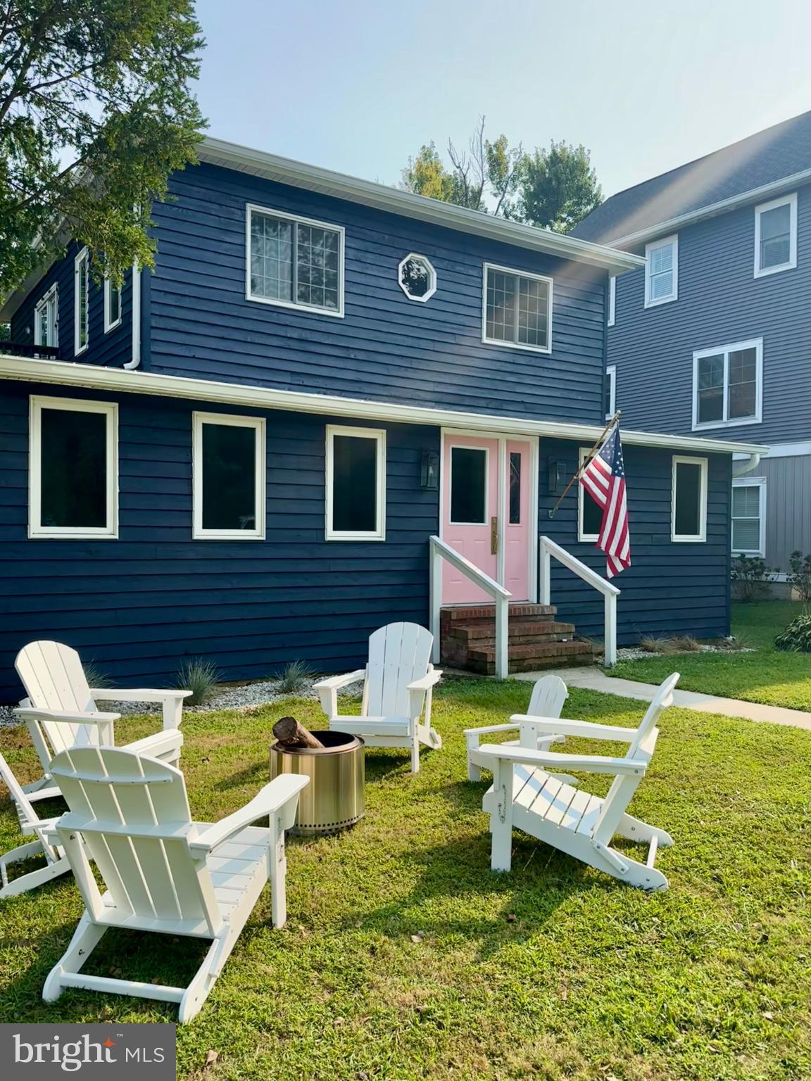 Charming Cedar siding with inviting outdoor space