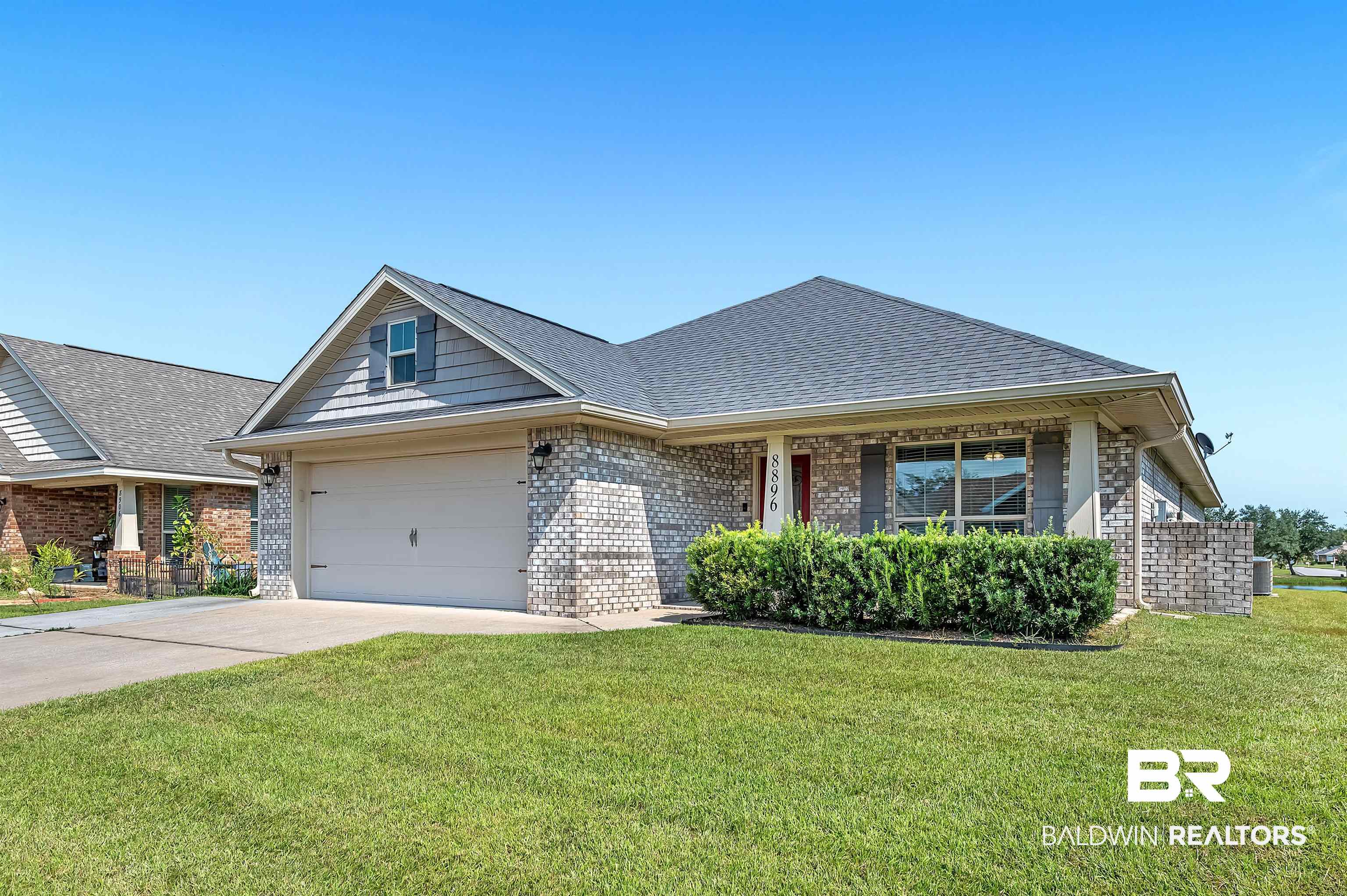 8896 Allay Lane Foley, AL 36535 - Photo 2 of 57 View of front of home featuring a garage and a front lawn