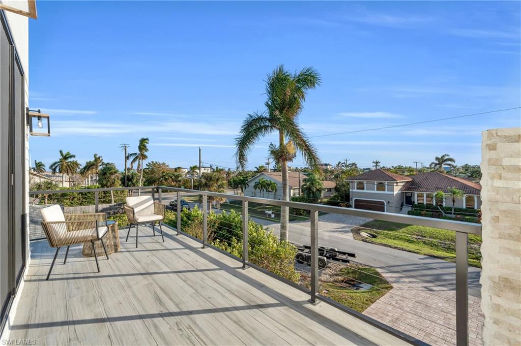 107 West Hilo Street Naples, FL 34113 - Photo 24 of 33 a view of a balcony with chairs