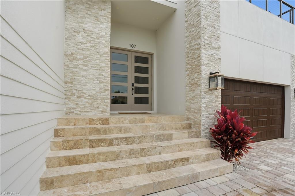 107 West Hilo Street Naples, FL 34113 - Photo 26 of 33 a view of house with entryway