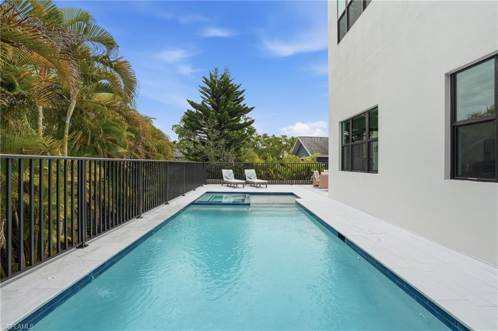 107 West Hilo Street Naples, FL 34113 - Photo 28 of 33 a view of balcony with two large garden and deck
