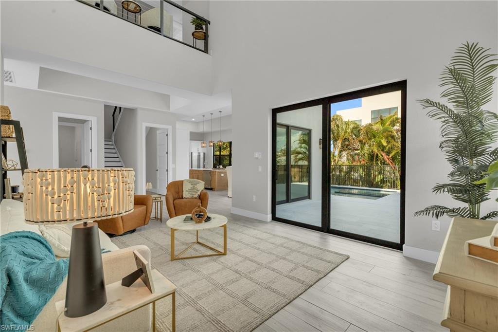 107 West Hilo Street Naples, FL 34113 - Photo 4 of 33 a living room with furniture and a window