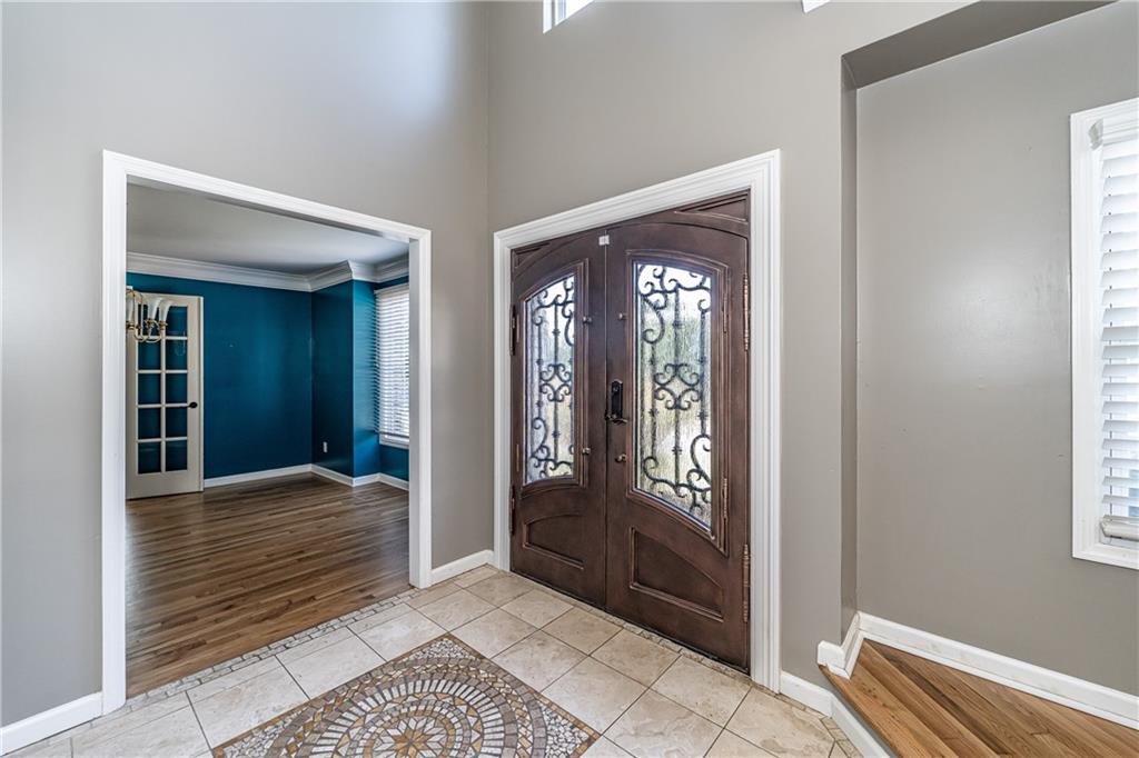 113 Warwick Way Rome, GA 30161 - Photo 4 of 49 a view of a hallway with wooden floor and a livingroom