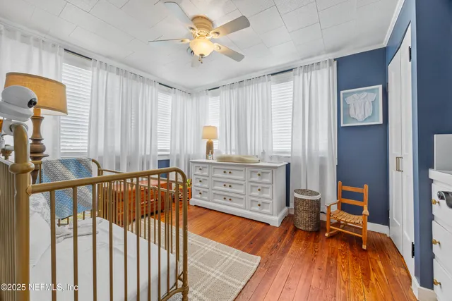 a bedroom with furniture and a window
