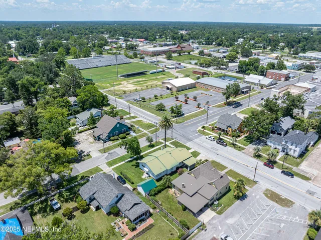 an aerial view of residential houses with outdoor space