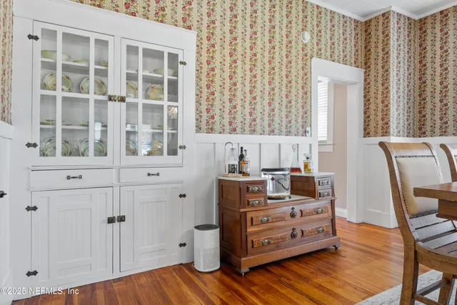 a view of kitchen with furniture and wooden floor
