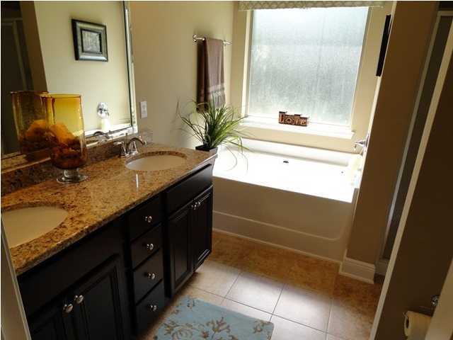 20 Pin Oak Loop Santa Rosa Beach, FL 32459 - Photo 8 of 14 a bathroom with a double vanity sink and a mirror