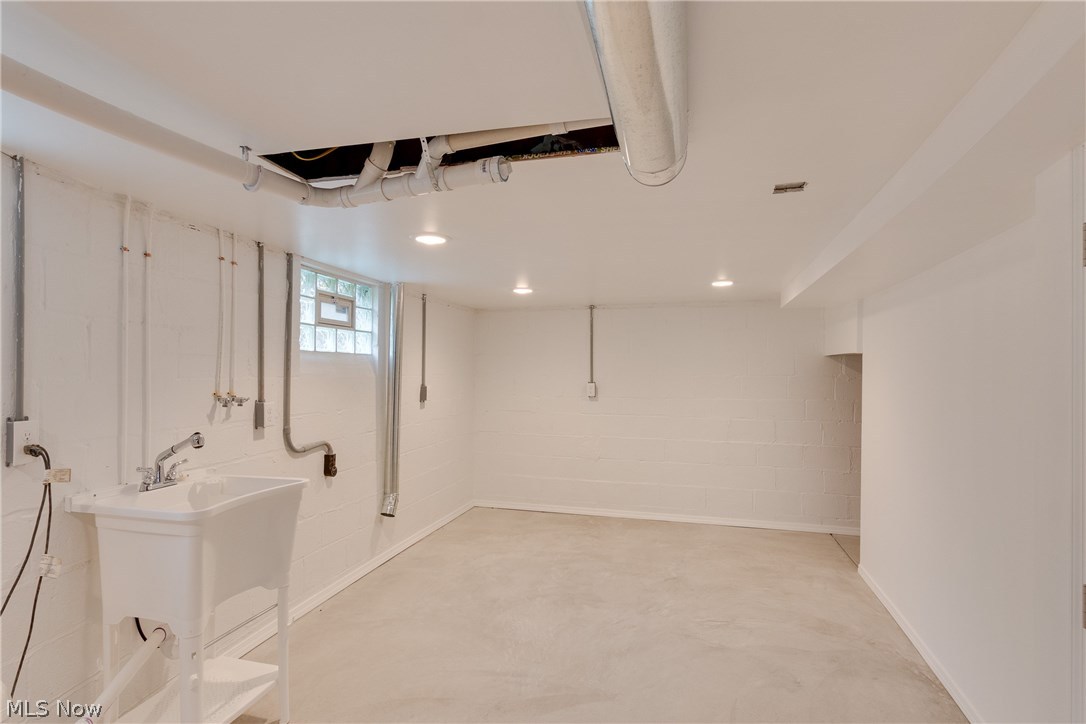 38705 Chardon Road Willoughby Hills, OH 44094 - Photo 29 of 35 Pristine laundry area in lower level comes with wash tub - glass block windows, new plumbing, new sump, everything is in immaculate condition at this home - like I said - nothing to do but move in and live for years to come