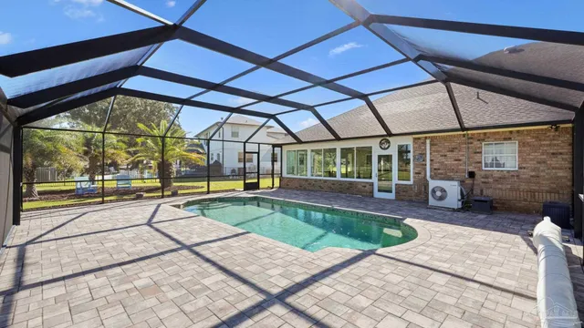a view of a swimming pool with a porch