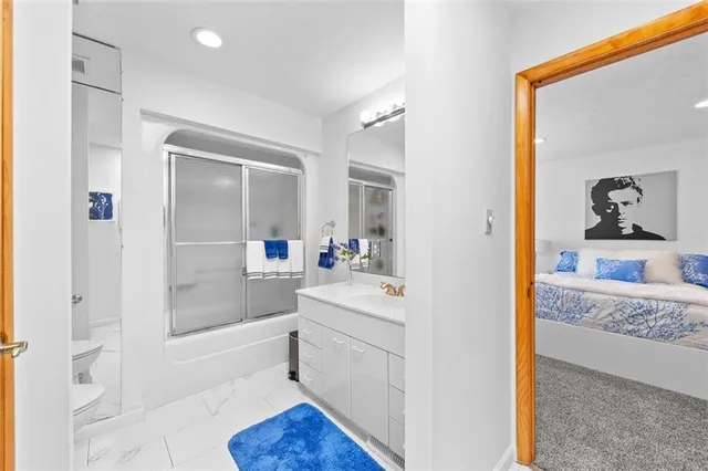 a bedroom with a bed and cabinets