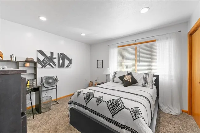 a bathroom with a sink mirror vanity and toilet