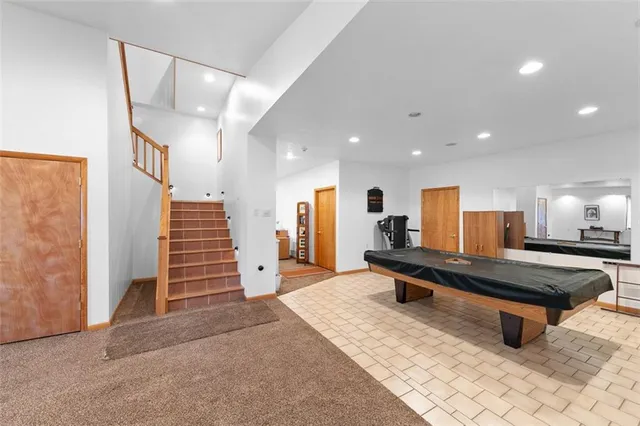 a view of a livingroom with a fireplace and window
