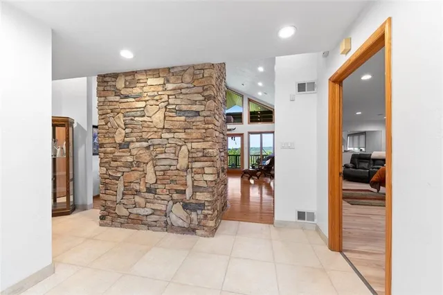 a view of an entryway with wooden floor