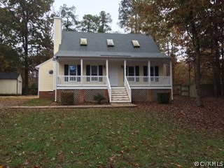 7507 Genuine Risk Lane Midlothian, VA 23112 - Photo 1 of 27 a front view of a house with a garden