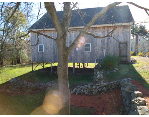 32 River Road Wayland, MA 01778 - Photo 4 of 8 a view of a house with a yard