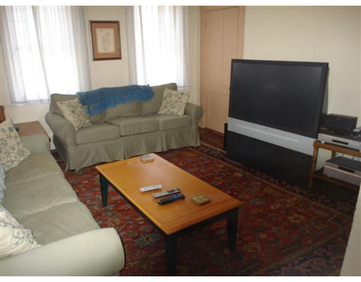 32 River Road Wayland, MA 01778 - Photo 5 of 8 a living room with furniture and a flat screen tv