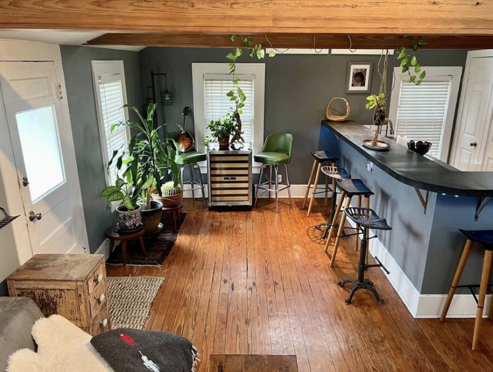 8811 High Valley Road Austin, TX 78737 - Photo 6 of 20 Rich hardwood floors and exposed wooden ceiling beams anchor this inviting bar area.