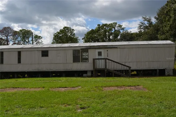 a view of a back yard of the house