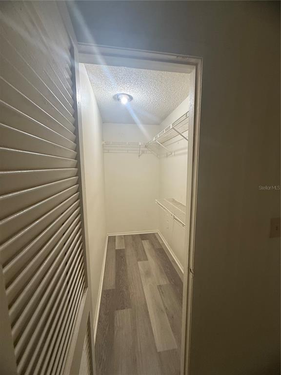 11707 Raintree Village Boulevard, Unit C Temple Terrace, FL 33617 - Photo 13 of 31 a view of a room with wooden floor