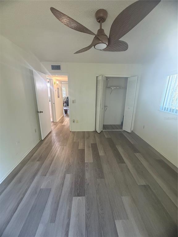 11707 Raintree Village Boulevard, Unit C Temple Terrace, FL 33617 - Photo 18 of 31 a view of empty room with wooden floor