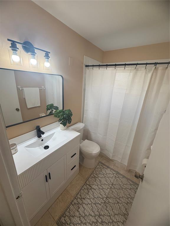 11707 Raintree Village Boulevard, Unit C Temple Terrace, FL 33617 - Photo 20 of 31 a bathroom with a sink toilet and shower