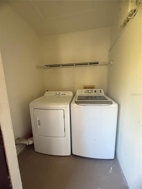 11707 Raintree Village Boulevard, Unit C Temple Terrace, FL 33617 - Photo 22 of 31 a utility room with dryer and washer