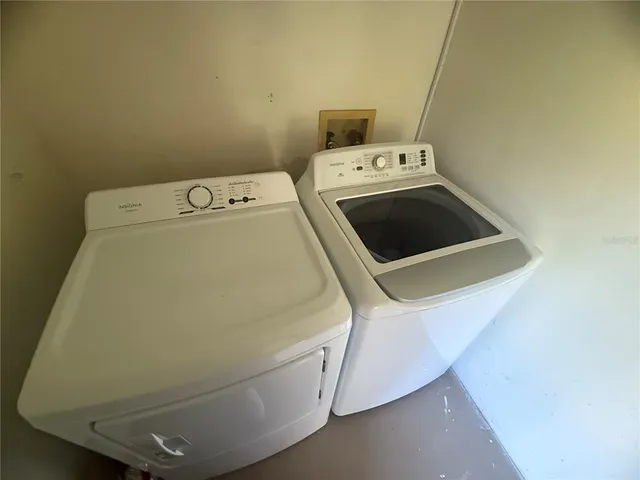 a utility room with dryer and washer