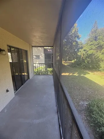 a balcony with view of swimming pool