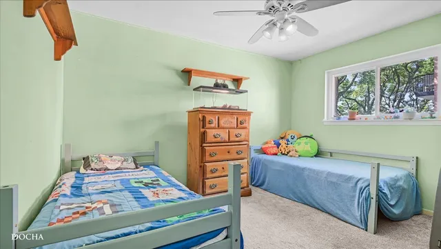 a bedroom with a bed and furniture