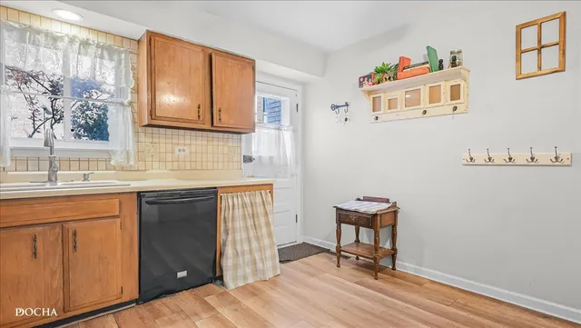 a view of a bedroom with a window and workspace