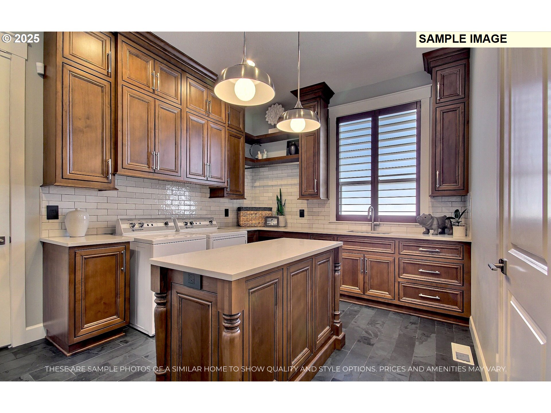 1617 North 41st Place Ridgefield, WA 98642 - Photo 13 of 34 a kitchen with kitchen island granite countertop a sink cabinets and stainless steel appliances