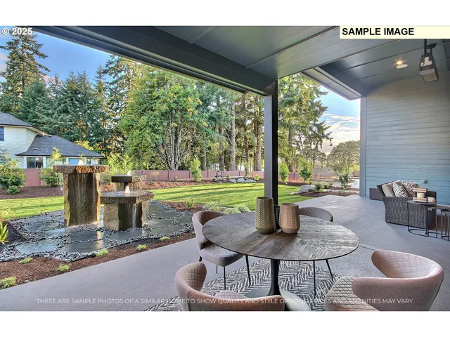 a backyard of a house with table and chairs