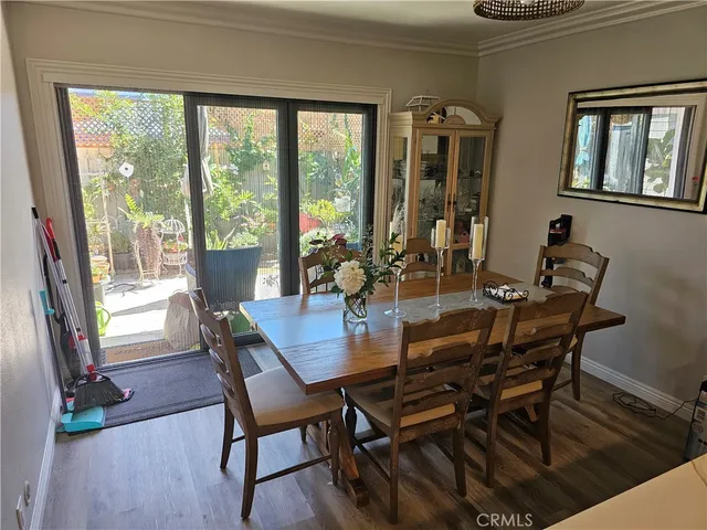 a bedroom with a bed and a mirror on the dresser