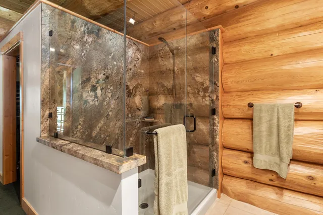 a bathroom with a shower and a sink