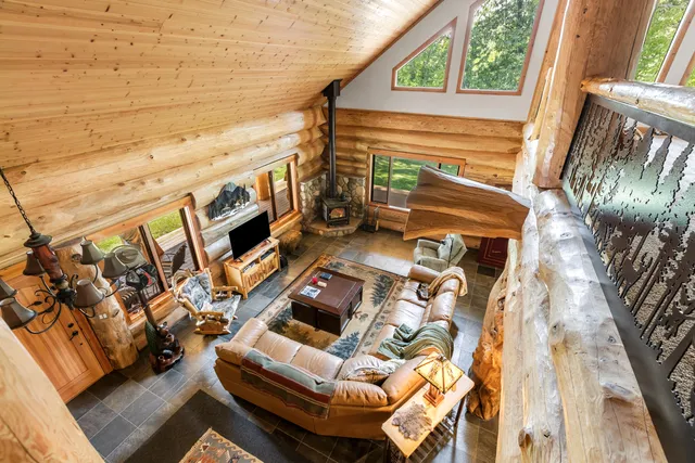 a view of an outdoor sitting area with brick walls