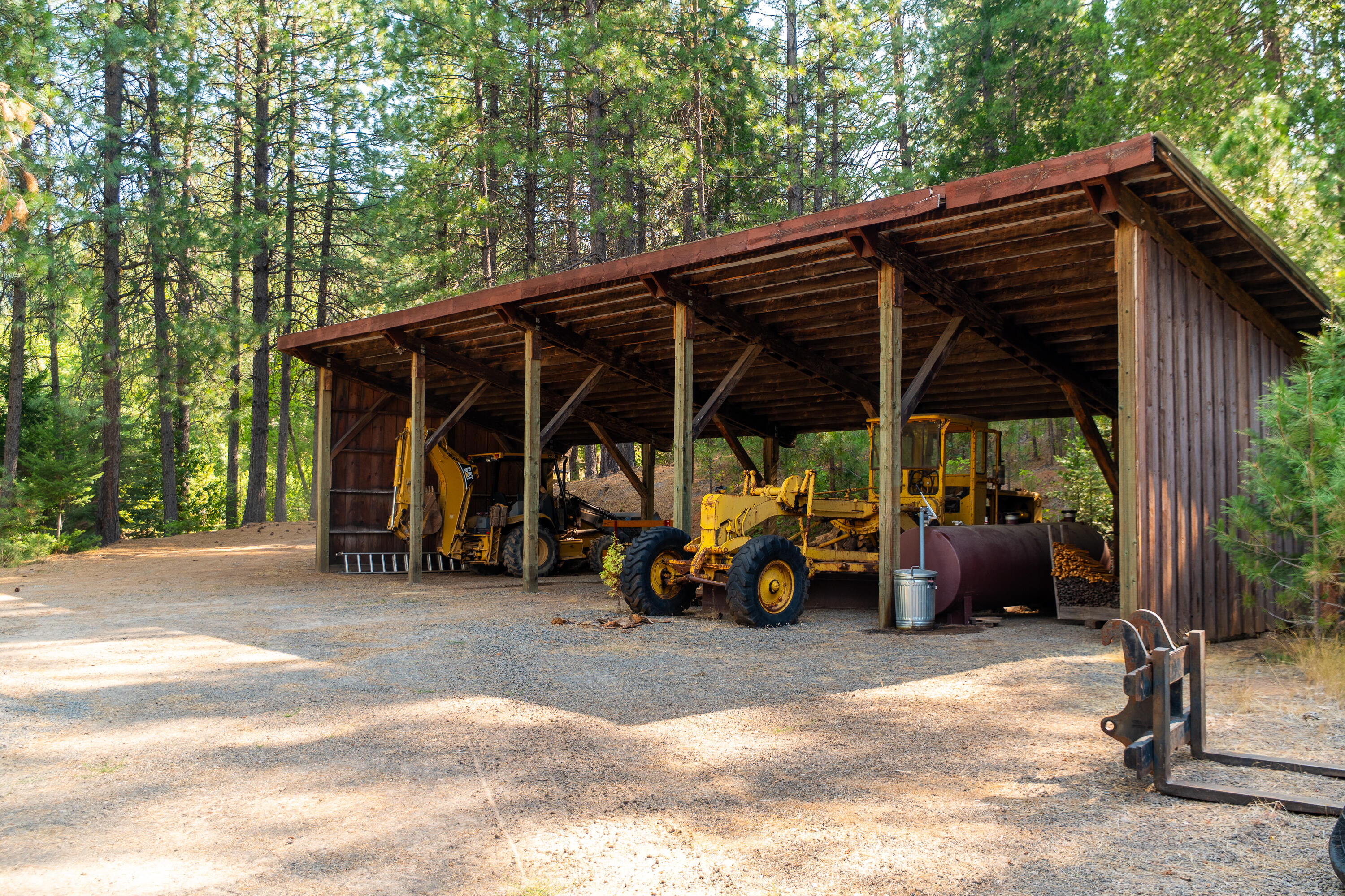 0 Summit Lake Road Montgomery Creek, CA 96065 - Photo 31 of 41 a view of a chair and table in the back yard of the house