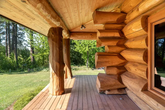 a view of balcony with wooden floor and outdoor seating