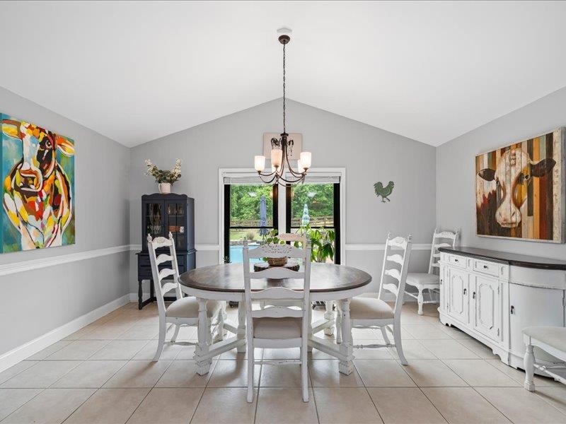 8104 Jack Bond Road Arlington, TN 38002 - Photo 10 of 40 a dining room with furniture a chandelier and window
