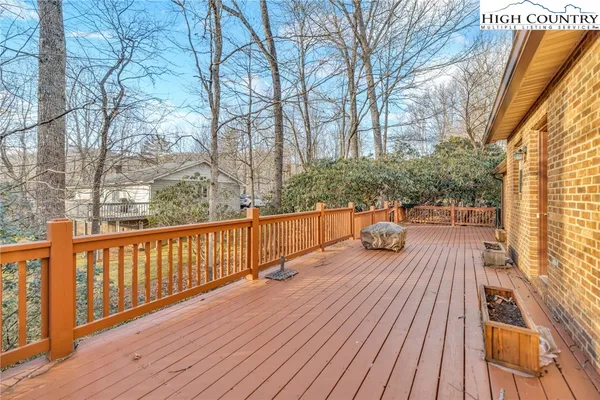 a view of deck with wooden floor and outdoor seating